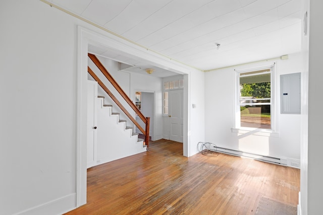 111 S High St, Edinburg, VA 22824 - interior space with a baseboard heating unit, stairs, hardwood / wood-style floors, and electric panel