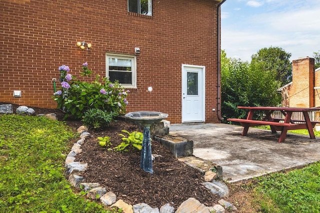 304 Burnley Dr, Staunton, VA 24401 - property entrance featuring brick siding and a patio area