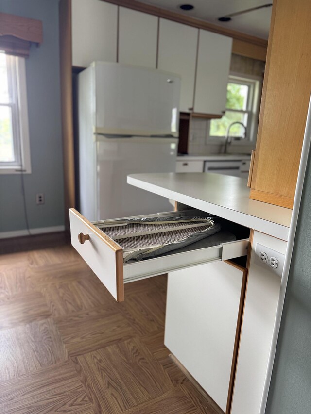 304 Burnley Dr, Staunton, VA 24401 - kitchen with freestanding refrigerator, light countertops, and white cabinetry