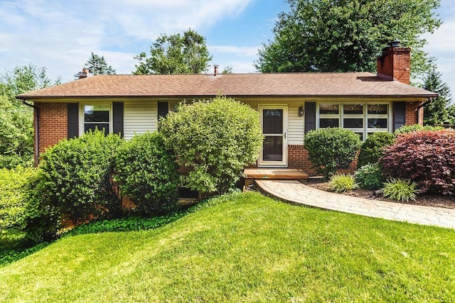 304 Burnley Dr, Staunton, VA 24401 - view of front facade with brick siding, a chimney, and a front lawn