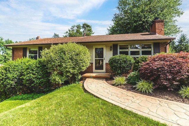 304 Burnley Dr, Staunton, VA 24401 - view of front of property featuring a chimney, brick siding, and a front lawn