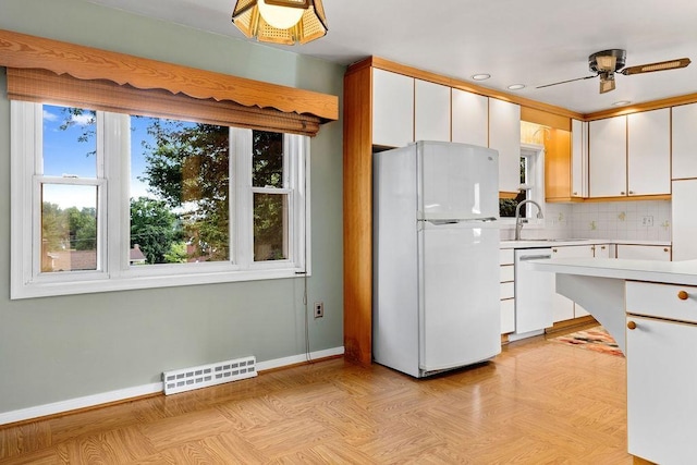304 Burnley Dr, Staunton, VA 24401 - kitchen featuring white appliances, light countertops, tasteful backsplash, a ceiling fan, and white cabinets