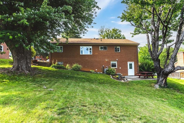 304 Burnley Dr, Staunton, VA 24401 - back of house featuring a lawn, a patio area, and brick siding
