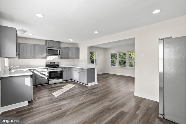 313 Burman Ln, Fredericksburg, VA 22407 - kitchen featuring stainless steel appliances, gray cabinets, baseboards, light countertops, and recessed lighting