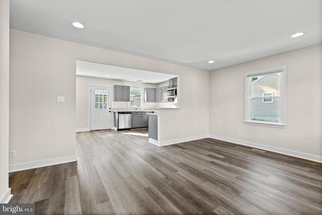 313 Burman Ln, Fredericksburg, VA 22407 - unfurnished living room with dark wood-type flooring, recessed lighting, and baseboards