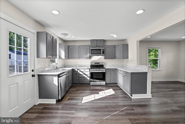 313 Burman Ln, Fredericksburg, VA 22407 - kitchen with gray cabinetry, appliances with stainless steel finishes, recessed lighting, light countertops, and a sink