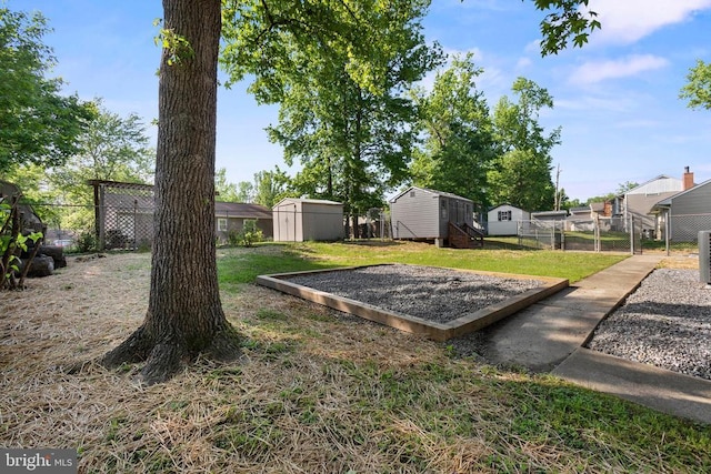 313 Burman Ln, Fredericksburg, VA 22407 - view of yard with a storage unit and an outbuilding