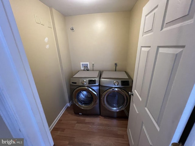 902 Eastover Pkwy, Locust Grove, VA 22508 - washroom featuring washing machine and dryer, wood finished floors, and baseboards