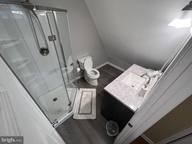 902 Eastover Pkwy, Locust Grove, VA 22508 - bathroom featuring a stall shower, vanity, wood finished floors, baseboards, and toilet