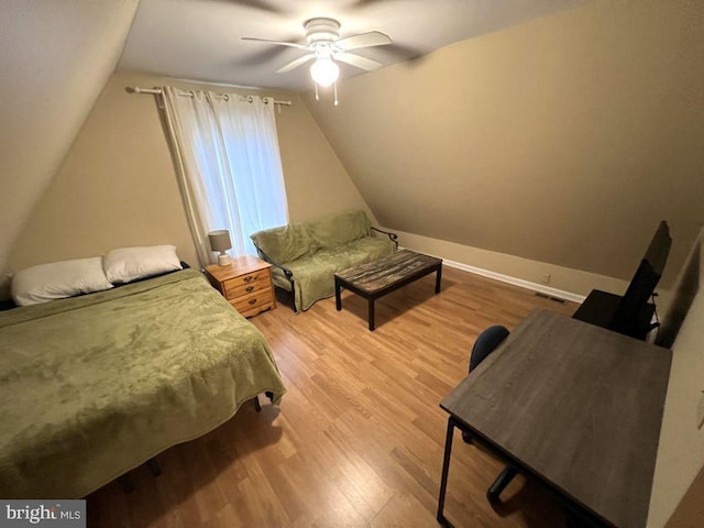 902 Eastover Pkwy, Locust Grove, VA 22508 - bedroom featuring wood finished floors, vaulted ceiling, a ceiling fan, and baseboards