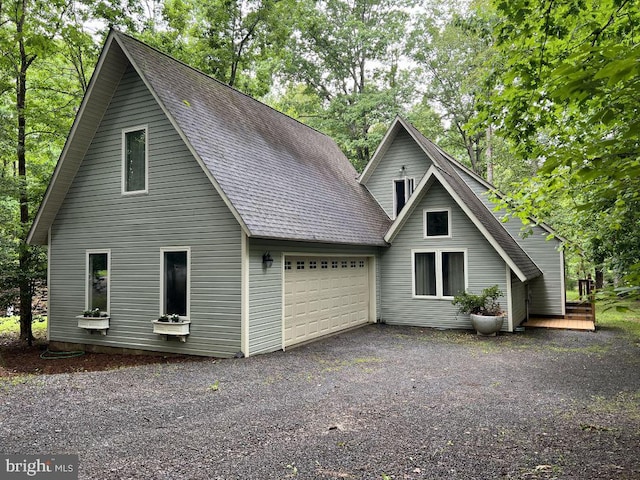 902 Eastover Pkwy, Locust Grove, VA 22508 - view of front facade with a garage, roof with shingles, and asphalt driveway