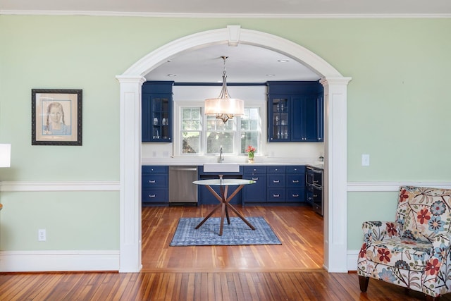 675 Beverley St E, Staunton, VA 24401 - home office with dark wood-type flooring, arched walkways, a sink, baseboards, and ornamental molding