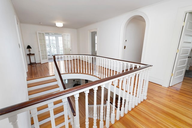 675 Beverley St E, Staunton, VA 24401 - stairs featuring wood finished floors, french doors, and arched walkways