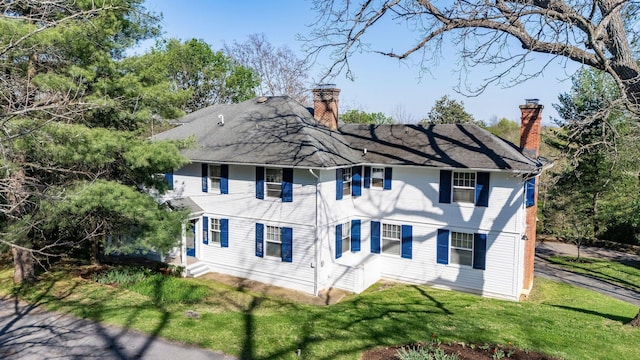 675 Beverley St E, Staunton, VA 24401 - back of property with a chimney and a lawn