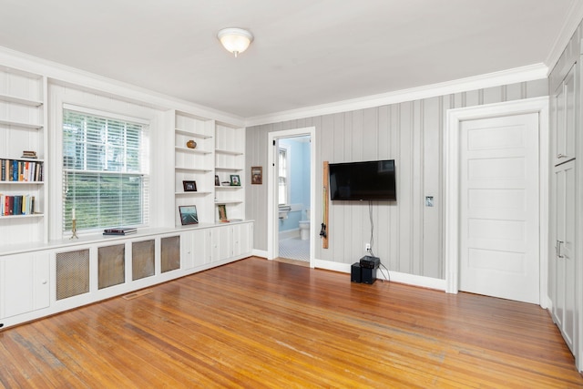 675 Beverley St E, Staunton, VA 24401 - unfurnished living room with ornamental molding, wood finished floors, built in features, and baseboards