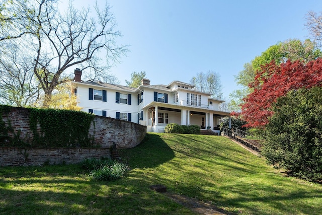 675 Beverley St E, Staunton, VA 24401 - view of front facade featuring a porch, a front lawn, and a chimney