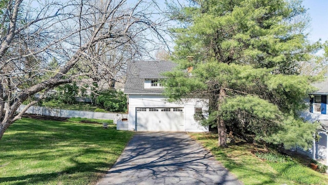 675 Beverley St E, Staunton, VA 24401 - view of property hidden behind natural elements featuring asphalt driveway, a garage, a front lawn, and a chimney