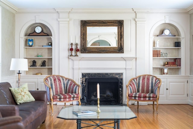 675 Beverley St E, Staunton, VA 24401 - living area with built in shelves, wood finished floors, crown molding, and a fireplace