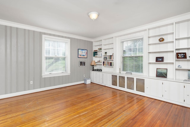675 Beverley St E, Staunton, VA 24401 - unfurnished living room featuring ornamental molding, wood finished floors, baseboards, and built in shelves