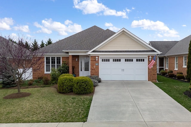 single story home featuring concrete driveway, an attached garage, brick siding, and a front yard