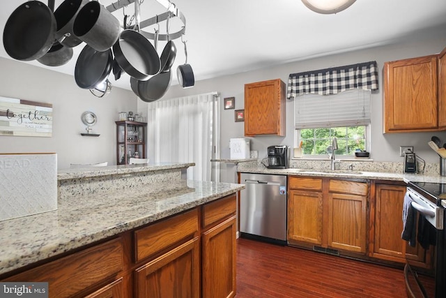 10708 Live Oak Ct, Fredericksburg, VA 22407 - kitchen with stainless steel appliances, brown cabinets, dark wood-style flooring, and light stone counters