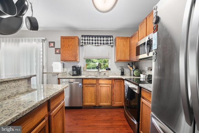 10708 Live Oak Ct, Fredericksburg, VA 22407 - kitchen with stainless steel appliances, dark wood-type flooring, brown cabinets, and light stone countertops