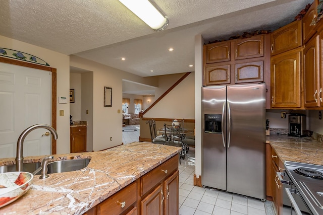 2226 Lanier Ln, Mcgaheysville, VA 22840 - kitchen with appliances with stainless steel finishes, light tile patterned floors, brown cabinets, a textured ceiling, and recessed lighting