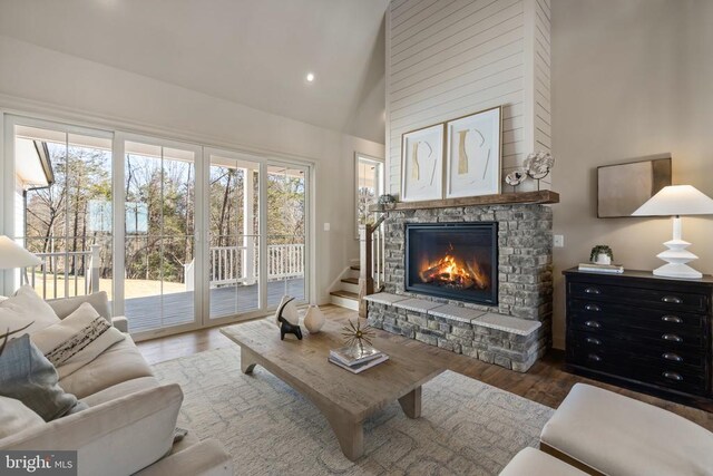 7039 Silk, Jeffersonton, VA 22724 - living area featuring a fireplace, high vaulted ceiling, wood finished floors, recessed lighting, and stairs