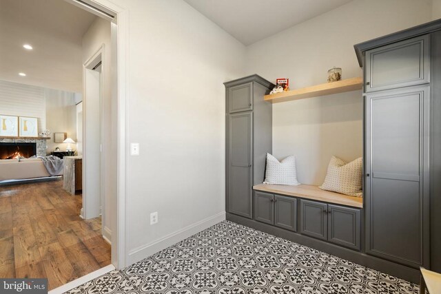 7039 Silk, Jeffersonton, VA 22724 - mudroom featuring recessed lighting, baseboards, and a warm lit fireplace