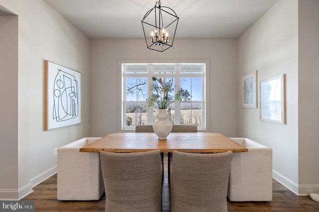 7039 Silk, Jeffersonton, VA 22724 - dining room featuring a chandelier, dark wood-type flooring, and baseboards