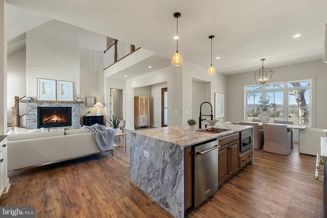 7039 Silk, Jeffersonton, VA 22724 - kitchen featuring a sink, stainless steel appliances, open floor plan, dark wood-type flooring, and a chandelier