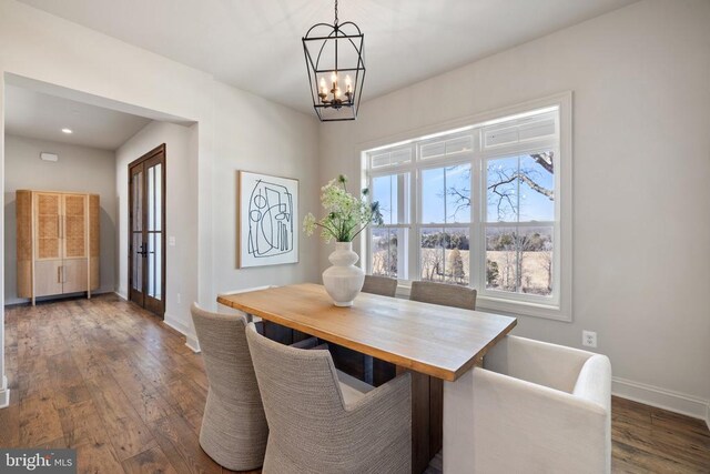7039 Silk, Jeffersonton, VA 22724 - dining area with a chandelier, baseboards, and dark wood-style flooring