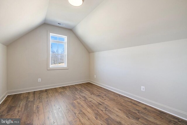 7039 Silk, Jeffersonton, VA 22724 - bonus room with dark wood-style flooring, lofted ceiling, and baseboards
