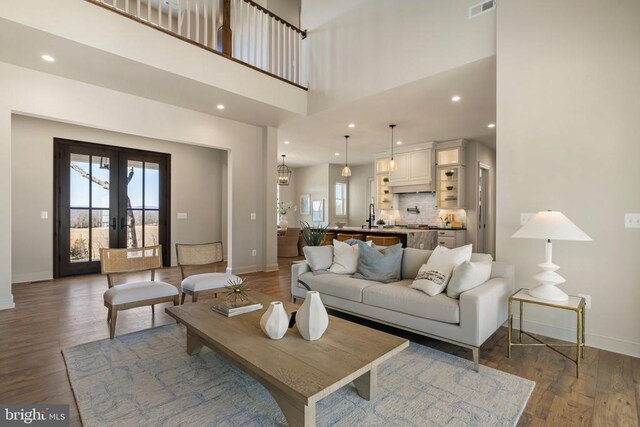 7039 Silk, Jeffersonton, VA 22724 - living room with baseboards, healthy amount of natural light, wood finished floors, a high ceiling, and recessed lighting