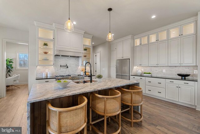 7039 Silk, Jeffersonton, VA 22724 - kitchen with freestanding refrigerator, ventilation hood, tasteful backsplash, a sink, and recessed lighting