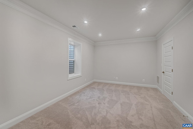 spare room with crown molding, light carpet, baseboards, and recessed lighting