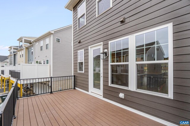 wooden deck featuring a residential view
