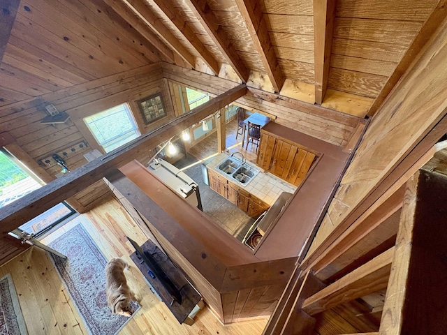 79 River Ridge Rd, Verona, VA 24482 - unfurnished living room featuring wood ceiling, wooden walls, plenty of natural light, and hardwood / wood-style flooring