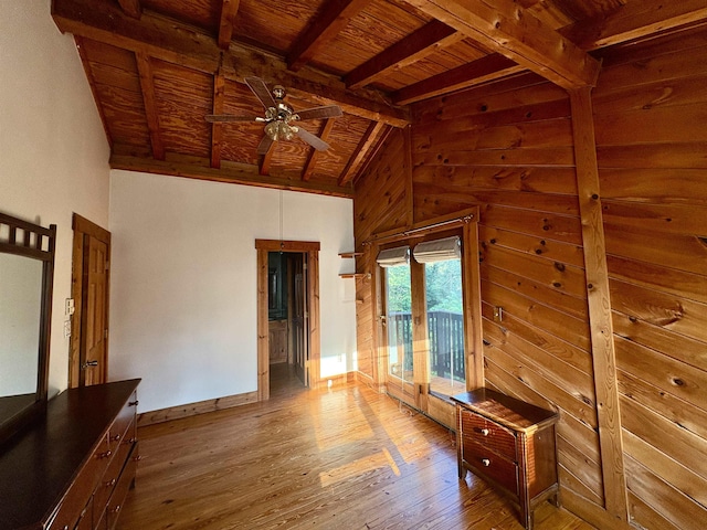 79 River Ridge Rd, Verona, VA 24482 - unfurnished living room with a wood ceiling with exposed beams, hardwood / wood-style floors, a ceiling fan, wood walls, and high vaulted ceiling