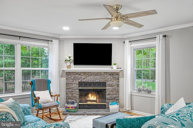 343 Aspen Hill Rd, Mineral, VA 23117 - living area with crown molding, plenty of natural light, a fireplace, and a ceiling fan