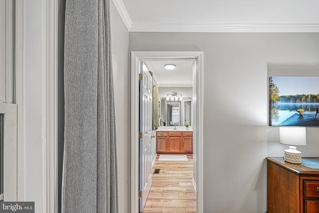 343 Aspen Hill Rd, Mineral, VA 23117 - hallway with ornamental molding and light wood-style flooring