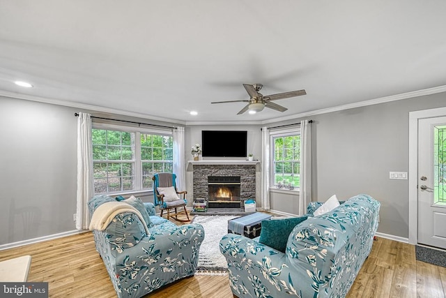 343 Aspen Hill Rd, Mineral, VA 23117 - living area with ornamental molding, a ceiling fan, wood finished floors, a fireplace, and baseboards