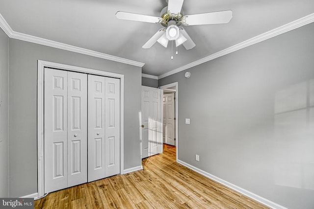 343 Aspen Hill Rd, Mineral, VA 23117 - unfurnished bedroom with baseboards, crown molding, wood finished floors, a closet, and a ceiling fan