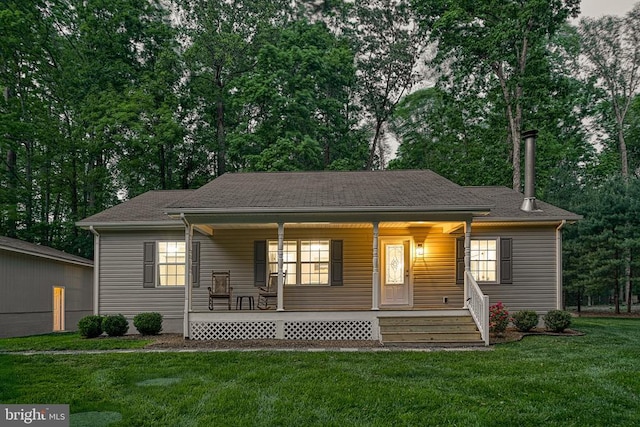 343 Aspen Hill Rd, Mineral, VA 23117 - view of front of house with covered porch, a front yard, and view of scattered trees