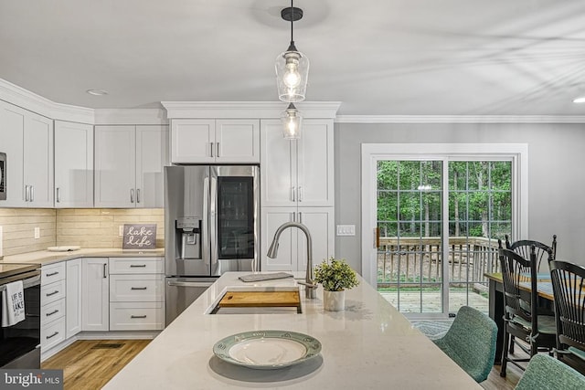 343 Aspen Hill Rd, Mineral, VA 23117 - kitchen with stainless steel appliances, white cabinetry, light stone counters, recessed lighting, and crown molding