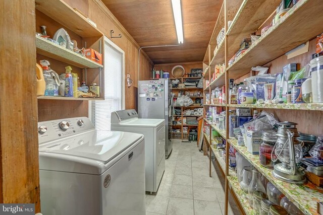202 Cutler Ave, Louisa, VA 23093 - laundry room with washing machine and dryer and light tile patterned flooring