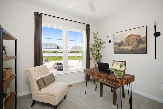 office area with baseboards, ceiling fan, carpet, and a wealth of natural light