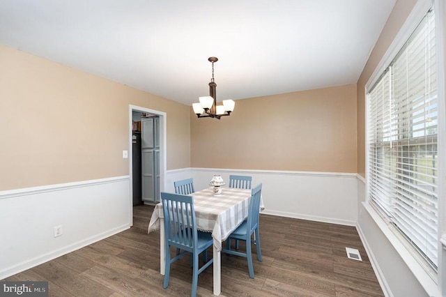 7504 Heathrow Dr, Fredericksburg, VA 22407 - dining room featuring wood finished floors, a chandelier, and baseboards