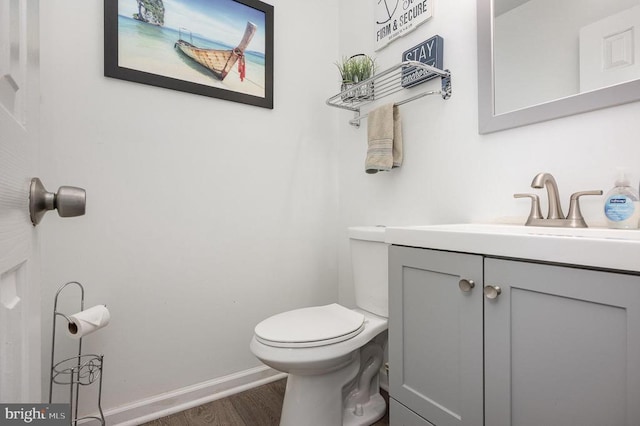 7504 Heathrow Dr, Fredericksburg, VA 22407 - bathroom with wood finished floors, vanity, toilet, and baseboards