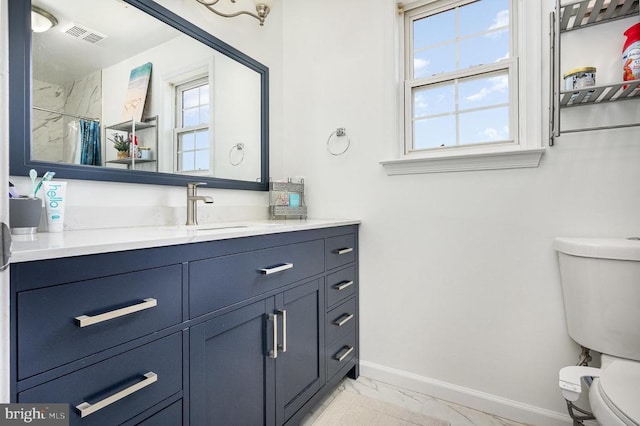 7504 Heathrow Dr, Fredericksburg, VA 22407 - bathroom with marble finish floors, toilet, baseboards, vanity, and curtained shower